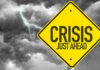 Allies ABANDON Trump — Strait Crisis Deepens Yellow sign reading Crisis Just Ahead with stormy sky