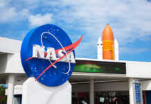 NASA logo with a space shuttle in the background