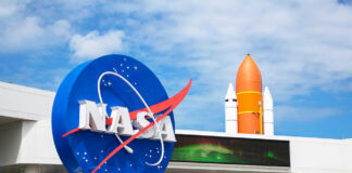 NASA logo with a space shuttle in the background