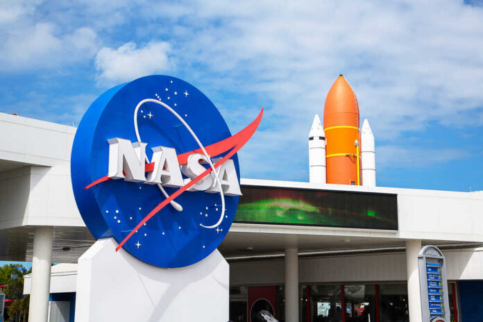 shutterstock_409828945.jpg NASA logo with a space shuttle in the background