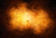 Bright orange cosmic explosion in space with stars around.