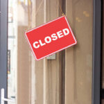 ALERT: 645 Stores CLOSING FOREVER A red 'CLOSED' sign hanging on a storefront door