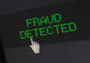 Fraud detected text with a pixelated cursor icon.