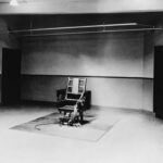 Electric Chairs Back? DOJ’s Execution Overhaul An empty execution room featuring an electric chair on a rug