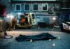 Mysterious Death: NBA Player Found Dead Police investigation at a crime scene with a covered body and evidence markers