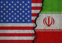 Military Standoff: US Strikes Inside Iran! United States and Iran flags divided by crack