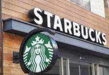 Starbucks SLASHES Jobs Again – Unrest Looms Starbucks cafe exterior with logo and sign