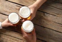 177-Year-Old Beer Brand RIP — Gone Forever? Three hands holding beer glasses in a toast