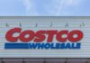 Costco Fiasco: Deadly Hazard! Costco Wholesale store sign against a blue sky