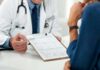 Doctor discussing a medical form with a patient
