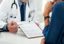 Doctor discussing a medical form with a patient