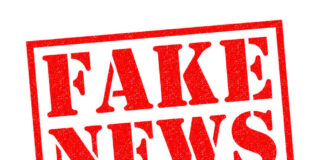 Fake news red stamp with textured appearance
