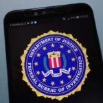 Pandemic Meal Scam Explodes — FBI Pounces FBI logo displayed on a smartphone screen