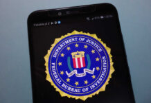 Pandemic Meal Scam Explodes — FBI Pounces FBI logo displayed on a smartphone screen