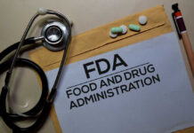 Big Cancer Win For A Select Few? Stethoscope and medication on a folder labeled FDA