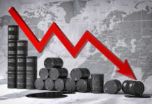 Graph depicting a decline in oil prices with barrels in the foreground