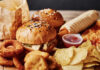Burger War Erupts – Big Moves Happening Now A variety of fast food items including burgers, onion rings, and chips