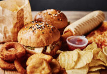 Burger War Erupts – Big Moves Happening Now A variety of fast food items including burgers, onion rings, and chips