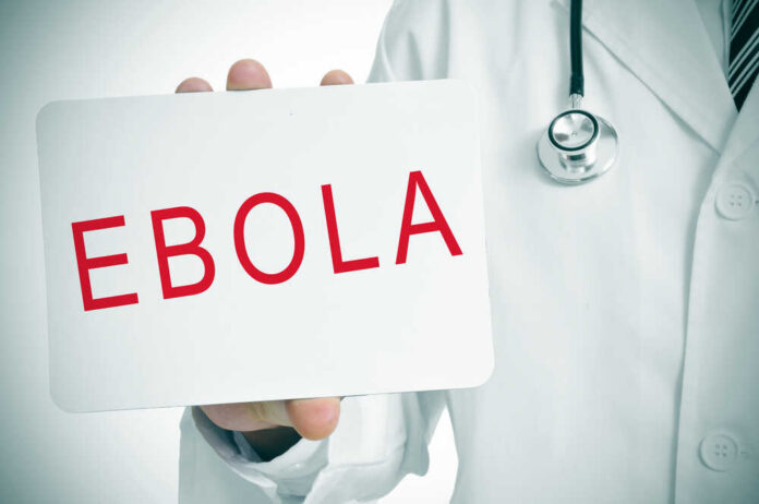 A,Doctor,Showing,A,Signboard,With,The,Word,Ebola,Written Doctor holding a sign about Ebola