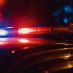 Tip Leads To Search — Body Found Close-up of a police car's emergency lights at night
