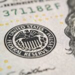 Fed King Dies — Who Really Ran Your Money? Close-up of a United States dollar bill featuring the Federal Reserve emblem