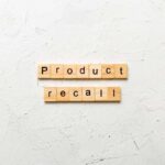 Vehicle Fire Alert – 1 Million Recalled Wooden letter tiles forming words on a white textured surface