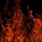 VIDEO: Deadly Resort Inferno – What Ignited This? Close-up of vibrant flames against a black background
