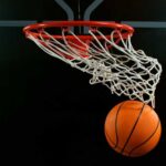 Basketball swishing through a hoop
