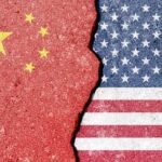 NOW: China Pipeline to U.S. Border Revealed? Cracked surface revealing the flags of China and the USA