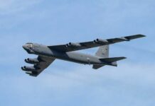 B-52 bomber flying against a blue sky