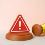 Stunning Judicial Rebuke: President Overruled A red warning sign next to a legal gavel on a light background
