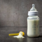 PARENTAL ALERT: Baby Bottles Recalled A baby bottle filled with milk next to a scoop of powdered formula