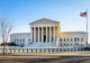 Supreme Court’s Silent Gut-Punch Hits Trump Supreme Court building with columns and U.S. flag