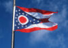 Ohio Governor Slams Trump Plan USCIS documents and a green card on a table