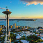 Space Needle overlooking Seattle waterfront at sunset