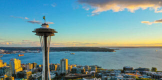 Space Needle overlooking Seattle waterfront at sunset