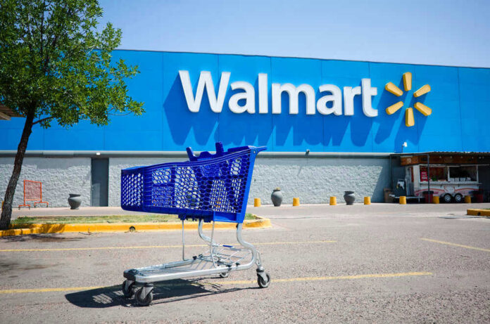 shutterstock_1871096929 Shopping cart in a Walmart parking lot.