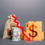 Inflation Reverses — What’s Really Driving It? A visual representation of financial decline with money and boxes
