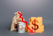 Inflation Reverses — What’s Really Driving It? A visual representation of financial decline with money and boxes