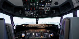 Interior view of an airplane cockpit with various instruments and controls