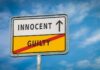 Killer Flip-Flop: ‘I’m Innocent Now’ A road sign displaying 'INNOCENT' with an arrow pointing up and 'GUILTY' crossed out