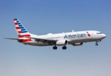 An American Airlines airplane in flight approaching for landing