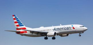 An American Airlines airplane in flight approaching for landing