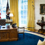 Supreme Court Supercharges Oval Office Power Presidential office with desk, flags, and portraits.