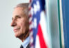Anthony Fauci close-up with flag.