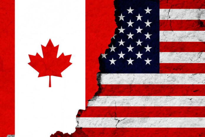 shutterstock_2589971947 Canadian and American flags with torn dividing line