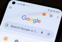 TODAY: Google Hit Hard — $1B Wake-Up Call? Close-up of a smartphone displaying the Google search interface