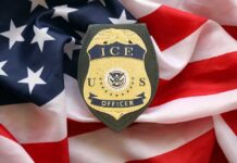 Wrong Man Killed? ICE Story Shifts ICE officer badge placed on an American flag