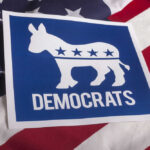 LIBS SHOCKED: Democrats Just Dumped THIS State?! Democrats logo on American flag background.