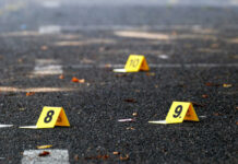 Yellow evidence markers labeled 8, 9, 10 on pavement.